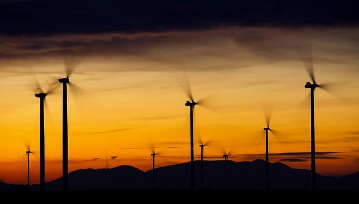 Wind energy is produced by the rotating blades of the turbine