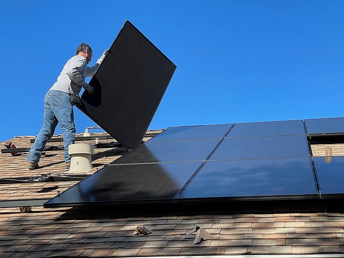 Installing a new solar panel system on the roof